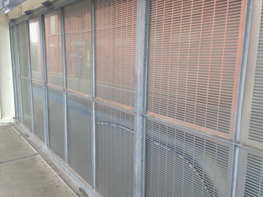 Galvanized metal railing at the CTA Fullerton station.